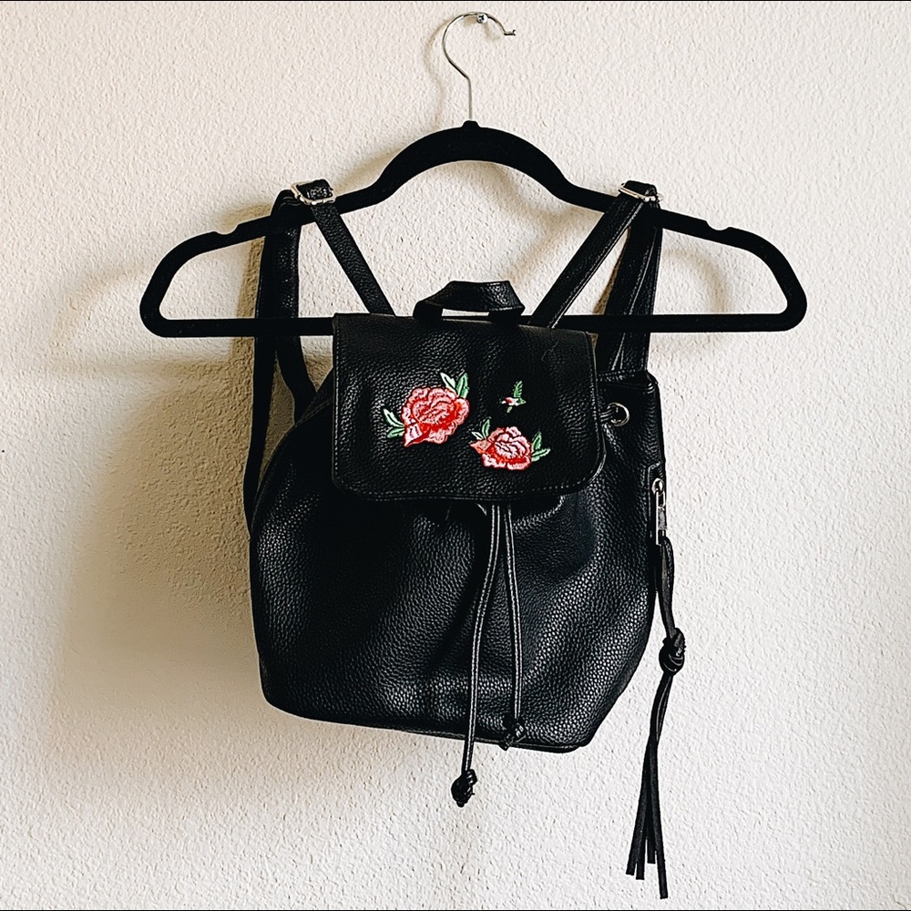 Embroidered rose mini backpack.